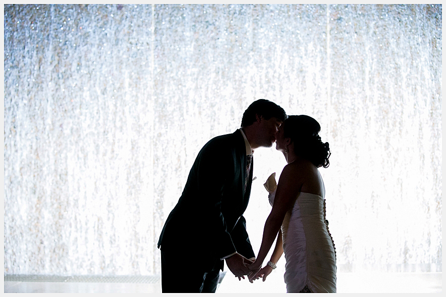 Bride and groom by the fountain