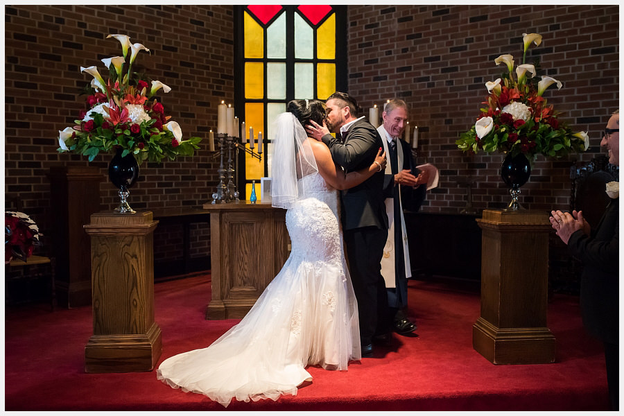 Bride and Groom kiss at the Old Mill